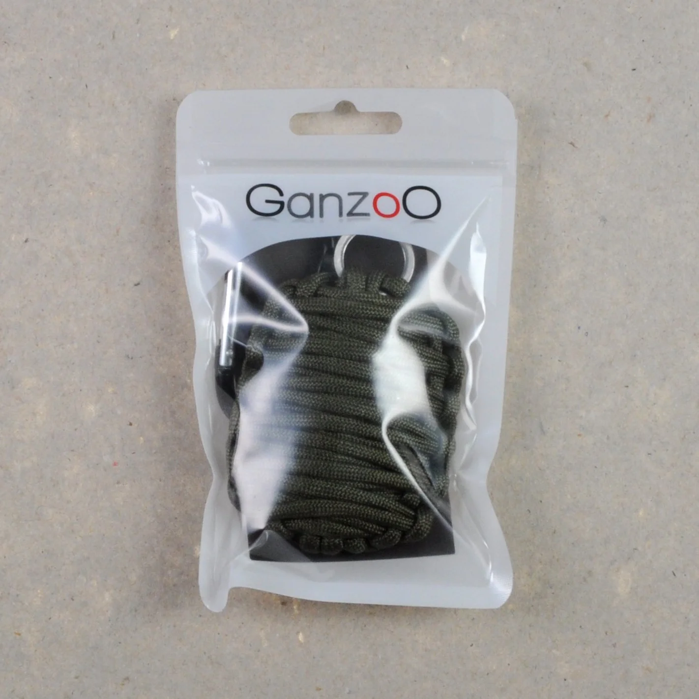 Ganzoo Paracord 550 12 elementow w jednym komplecie awaryjnym, oliwkowy, lina 3,4 m, 51 g, karabinek do mocowania, mini noz, mini pila, krzesiwo, rozpalka, folia aluminiowa, dodatki do wedkowania